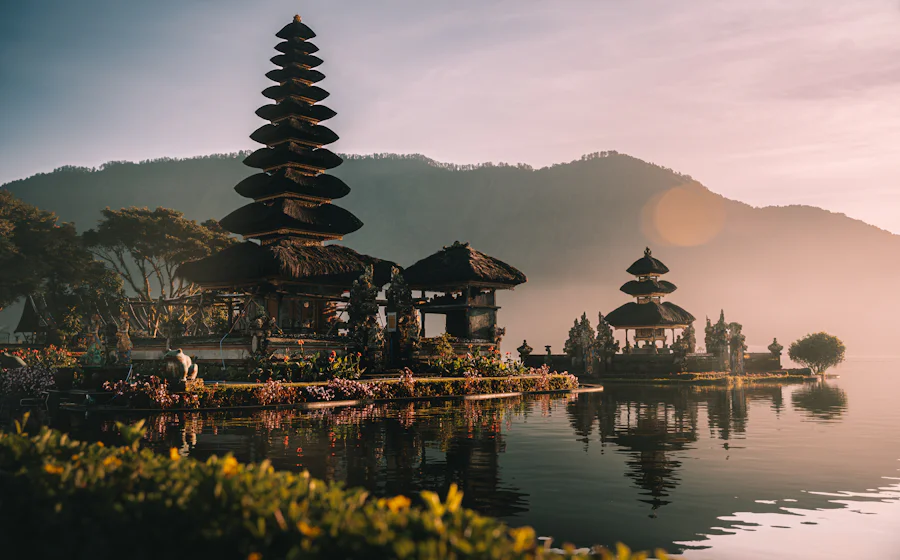 Pura Ulun Danu Bratan temple on a lake in Bali at golden hour