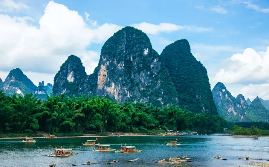 Bamboo rafts on the Li River below green karst mountains near Guilin